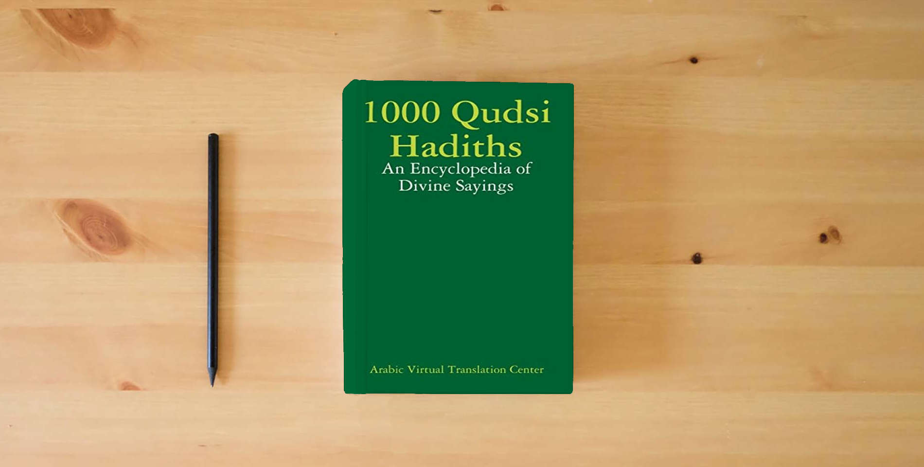 The book 1000 Qudsi Hadiths: An Encyclopedia of Divine Sayings is on the table