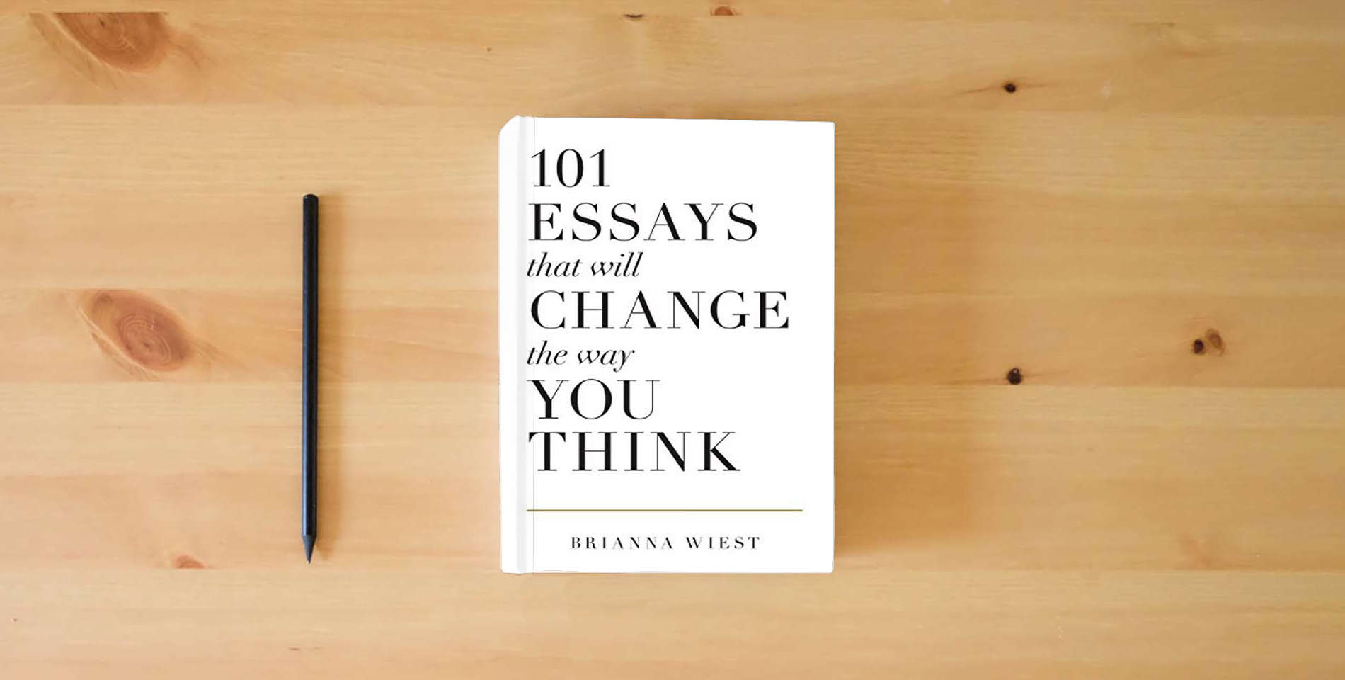 The book 101 Essays That Will Change The Way You Think is on the table