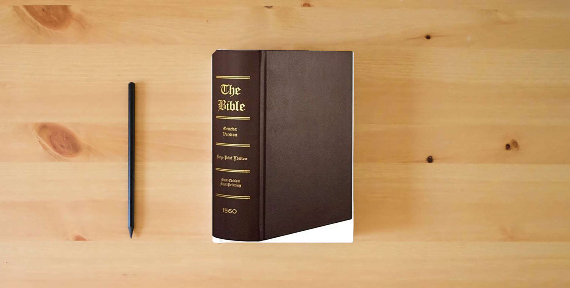 The book 1560 Geneva Bible - First Edition Facsimile Regular Edition - Hardcover - Burgundy is on the table