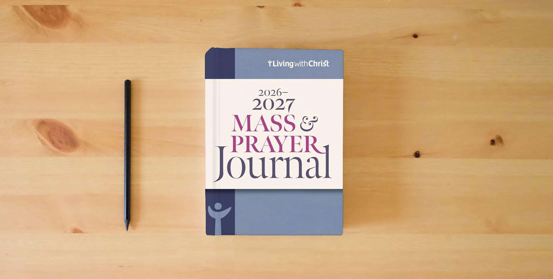 The book 2026-2027 Mass & Prayer Journal is on the table