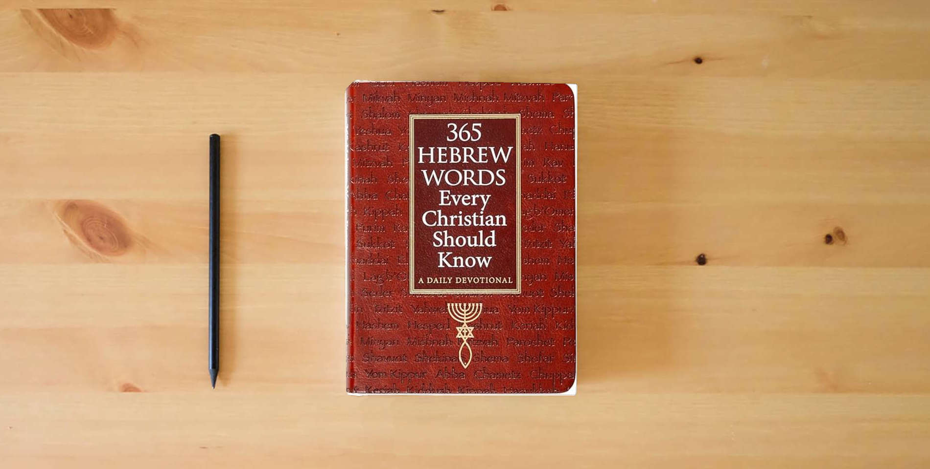 The book 365 Hebrew Words Every Christian Should Know: A Daily Devotional – Watch the Bible Come Alive Through the Hebrew Language and Jewish Traditions is on the table
