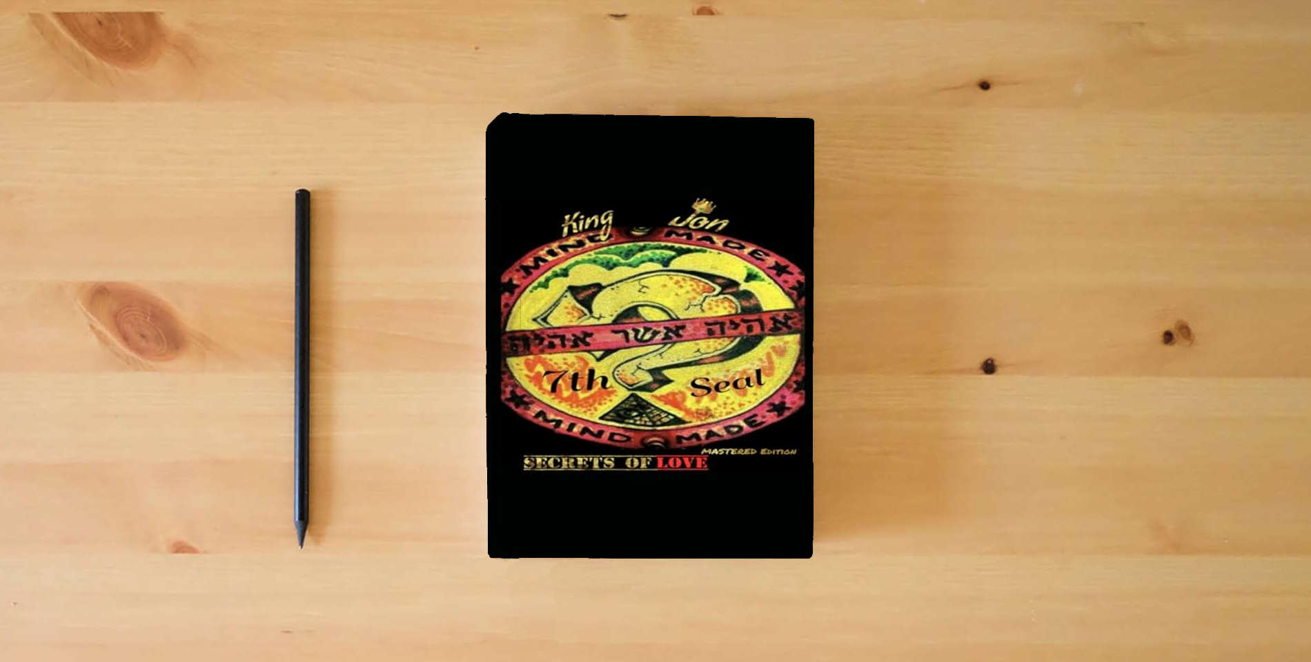The book 7th Seal: Secrets Of Love is on the table