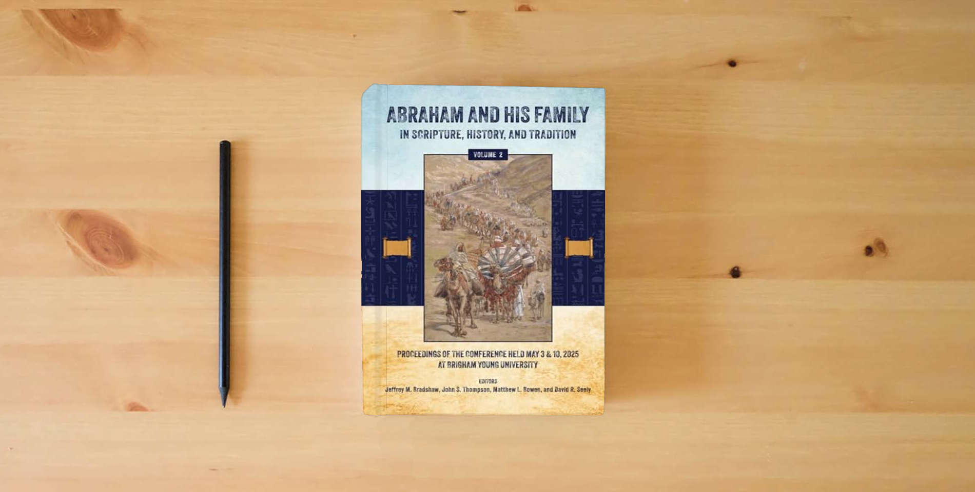 The book Abraham and His Family in Scripture, History, and Tradition (Volume 2, color) is on the table