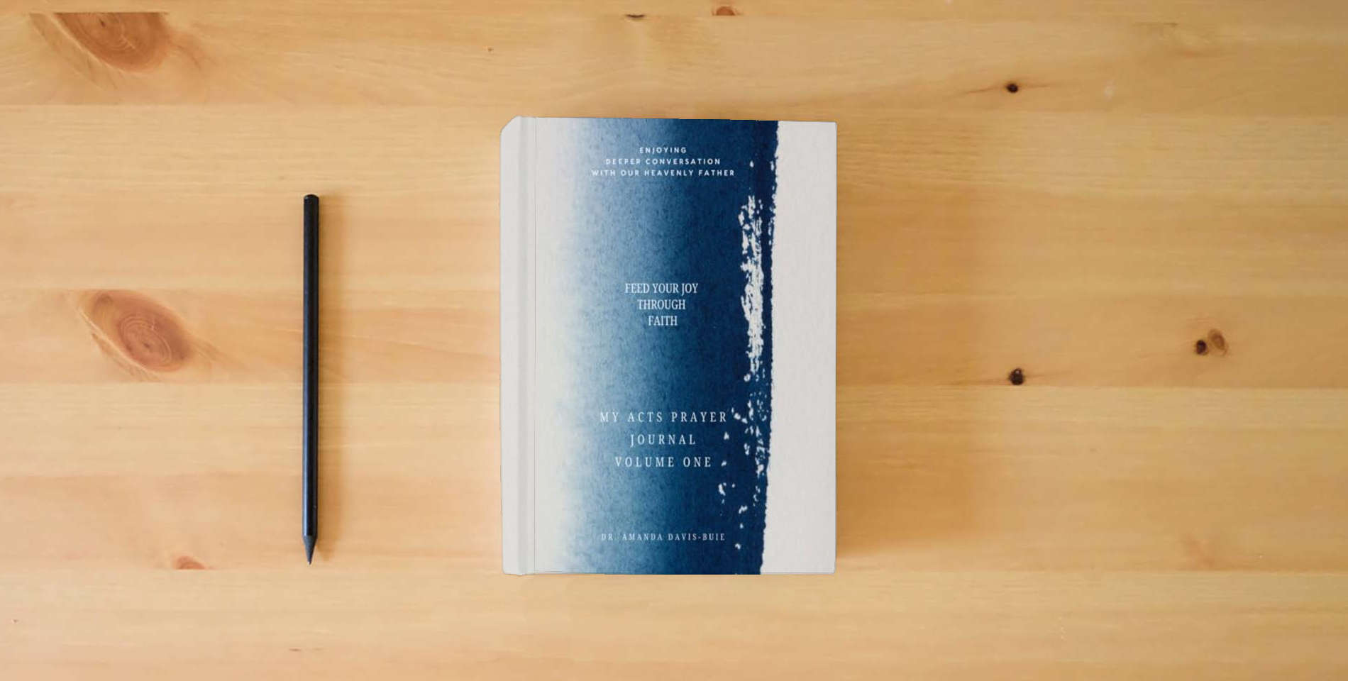 The book My ACTS Prayer Journal: Feed Your Joy Through Faith - Volume One is on the table