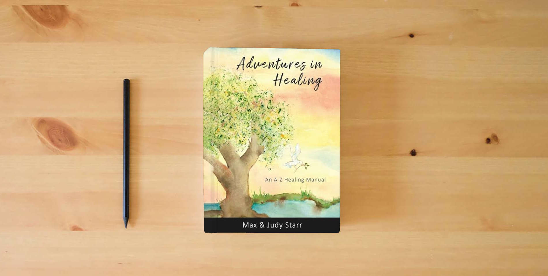 The book Adventures in Healing: An A-Z Healing Manual is on the table
