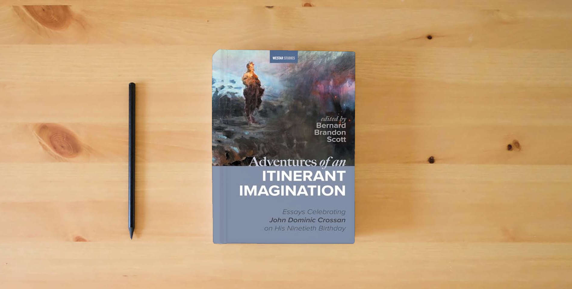 The book Adventures of an Itinerant Imagination: Essays Celebrating John Dominic Crossan on His Ninetieth Birthday (Westar Studies) is on the table