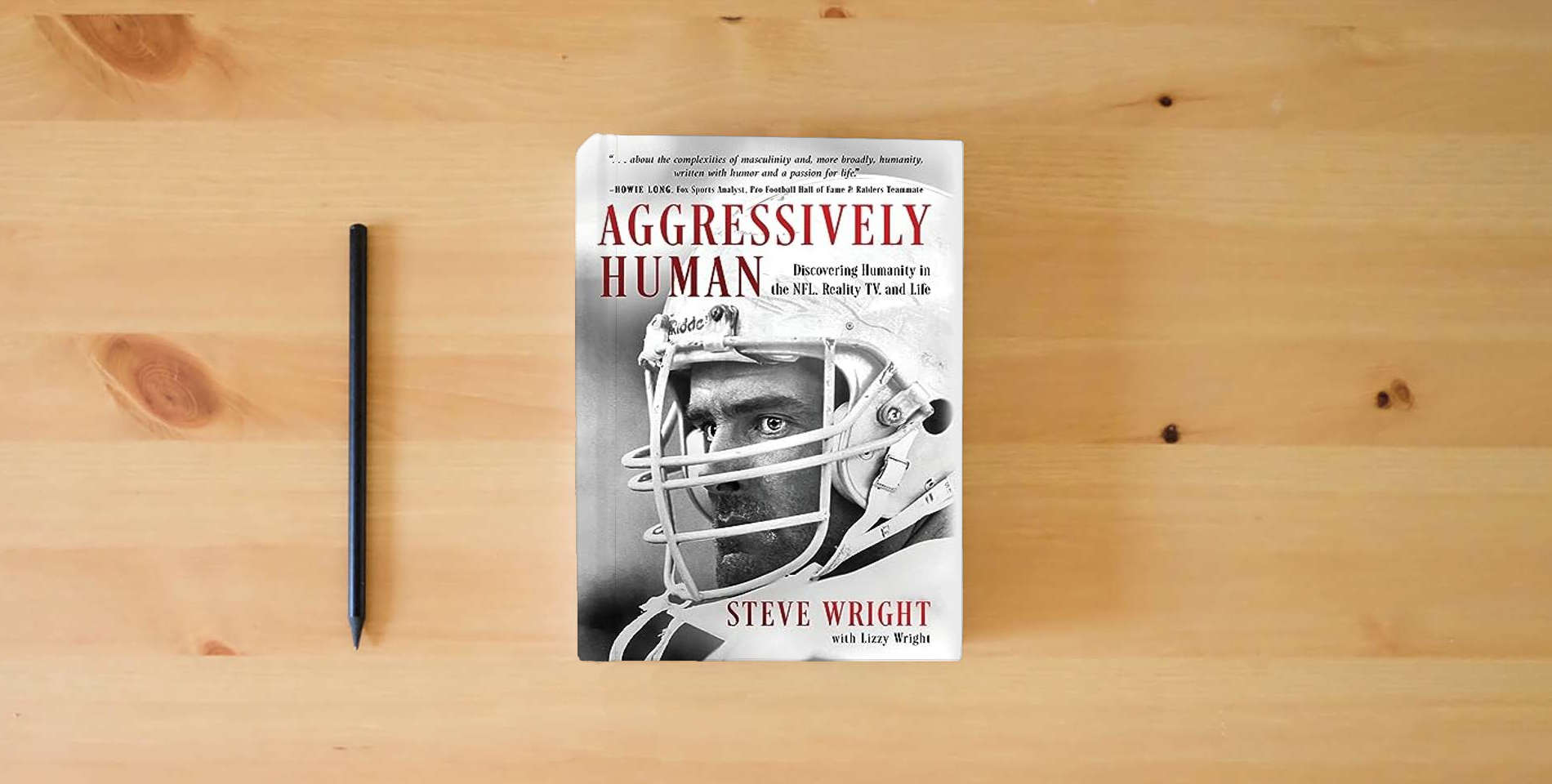 The book Aggressively Human: Discovering Humanity in the NFL, Reality TV, and Life is on the table