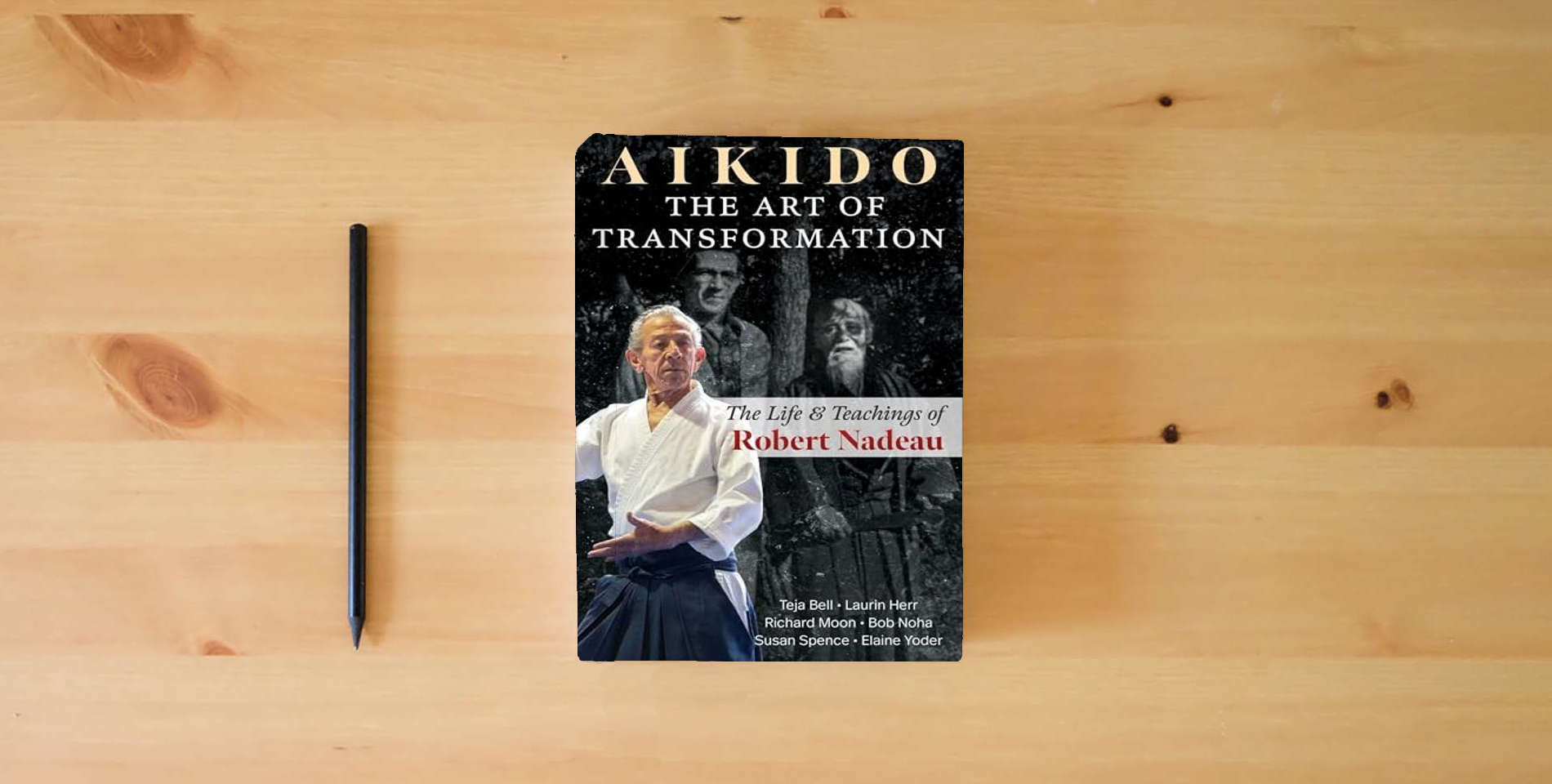 The book Aikido: The Art of Transformation: The Life and Teachings of Robert Nadeau is on the table