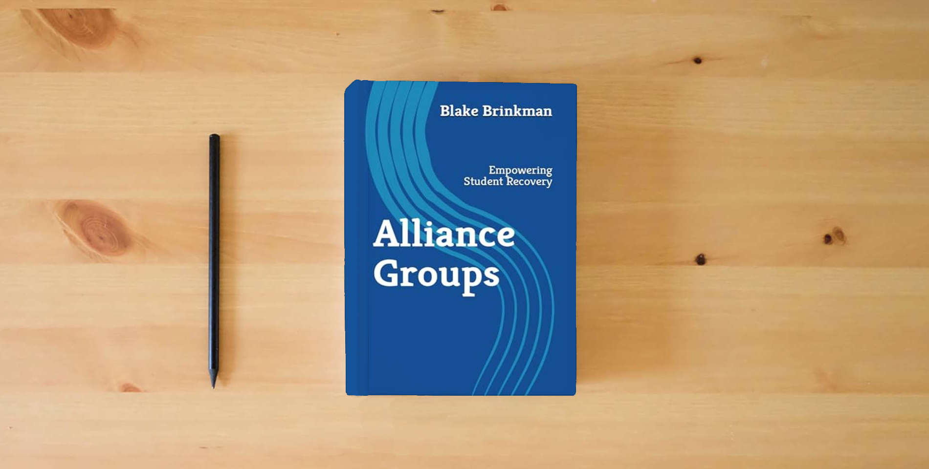 The book Alliance Groups: Empowering Student Recovery is on the table