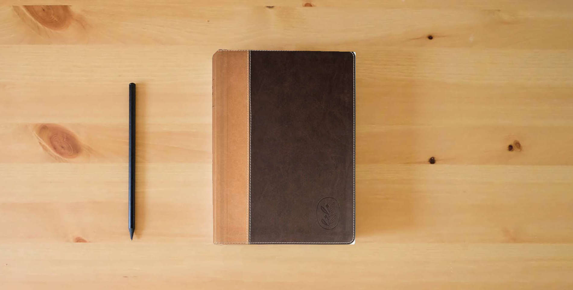 The book Anabaptist Community Bible: Hardcover Edition is on the table
