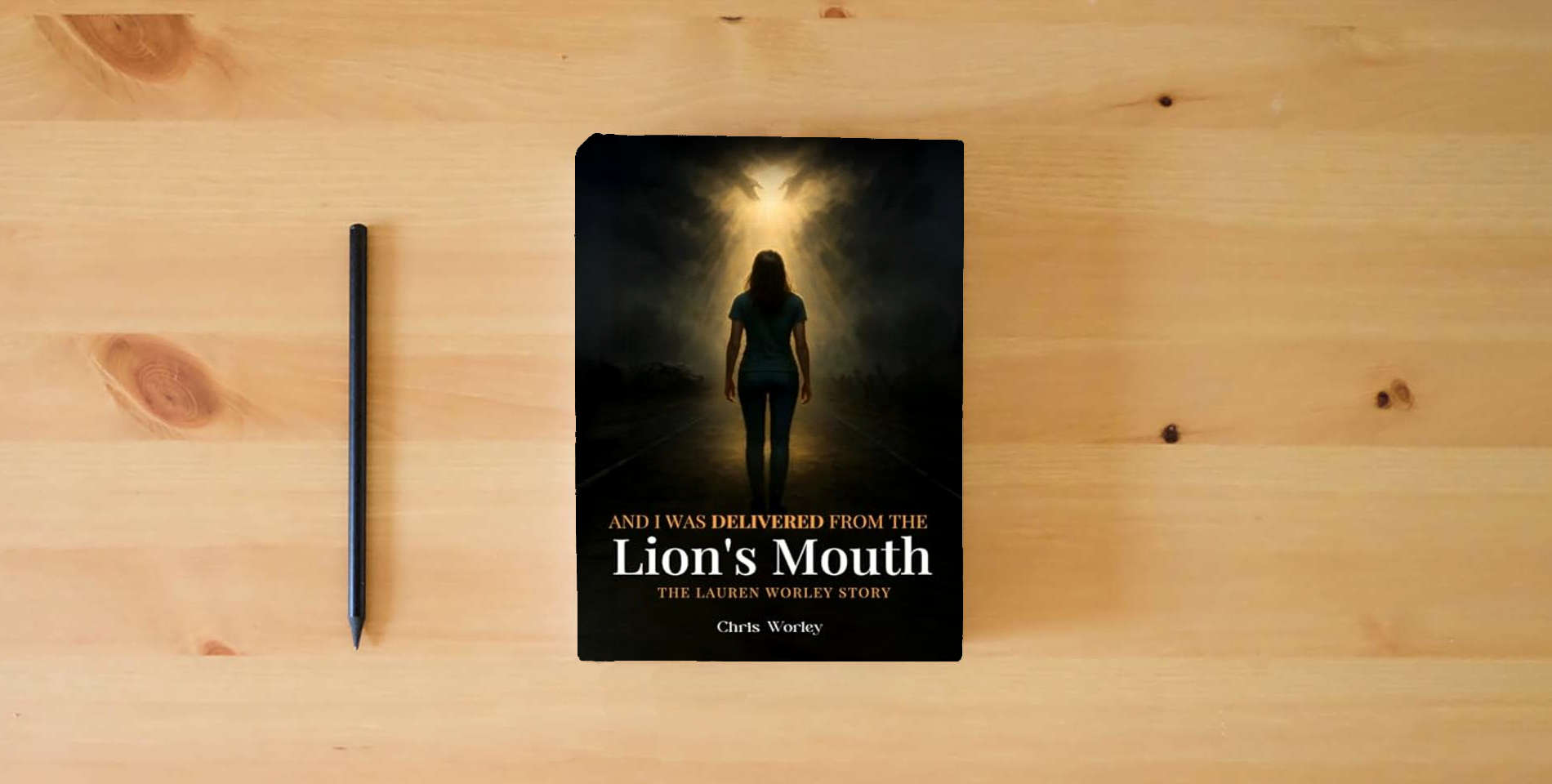 The book And I Was Delivered from the Lion’s Mouth: The Lauren Worley Story is on the table