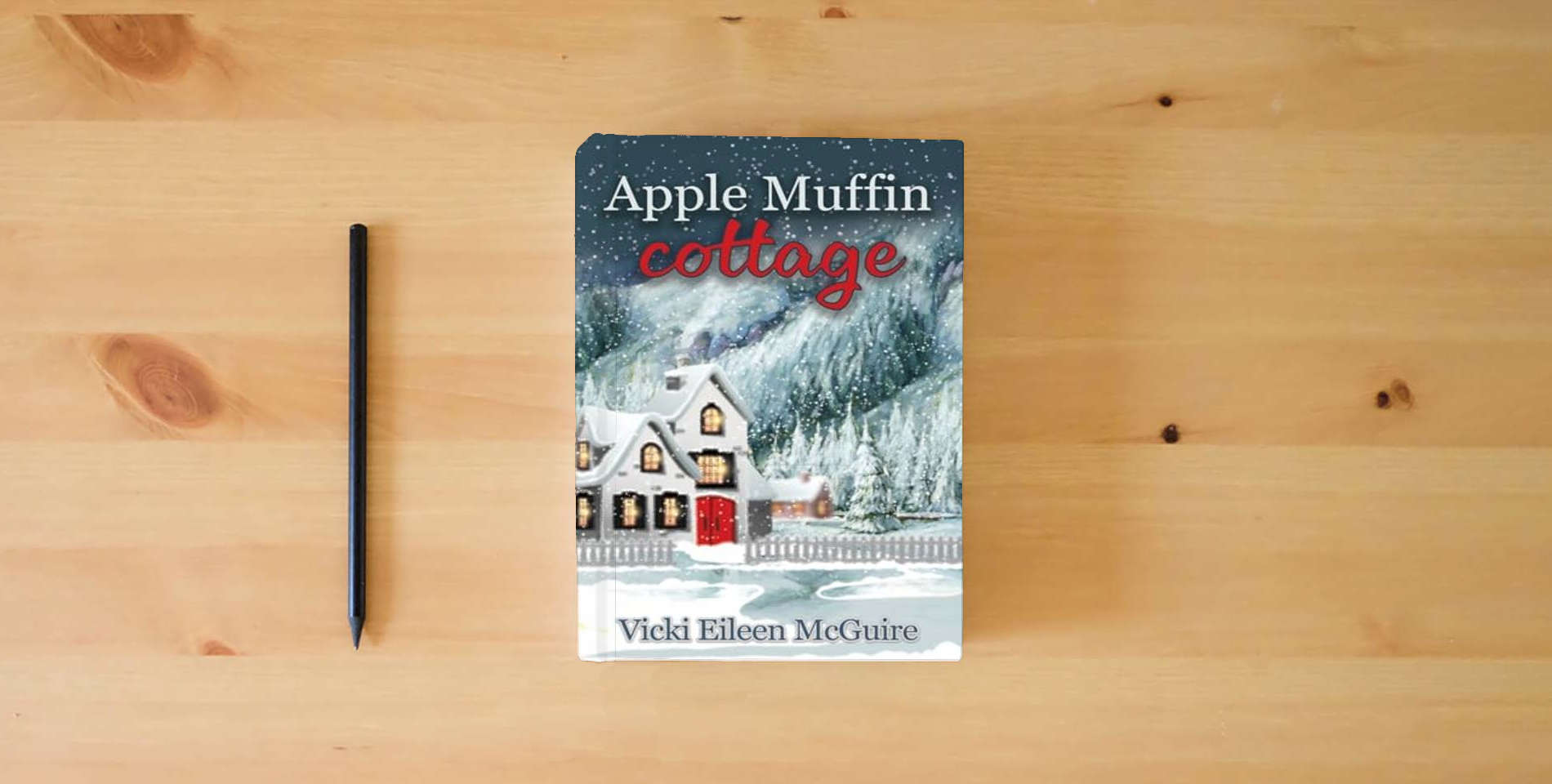 The book Apple Muffin Cottage is on the table