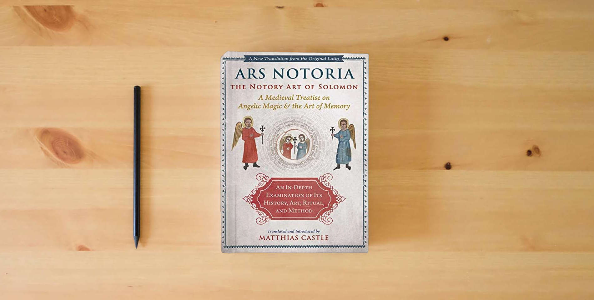 The book Ars Notoria: The Notory Art of Solomon: A Medieval Treatise on Angelic Magic and the Art of Memory is on the table