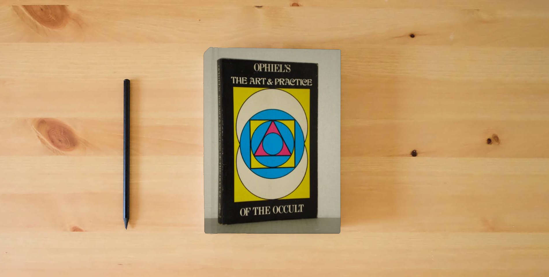 The book Art and Practice of the Occult is on the table