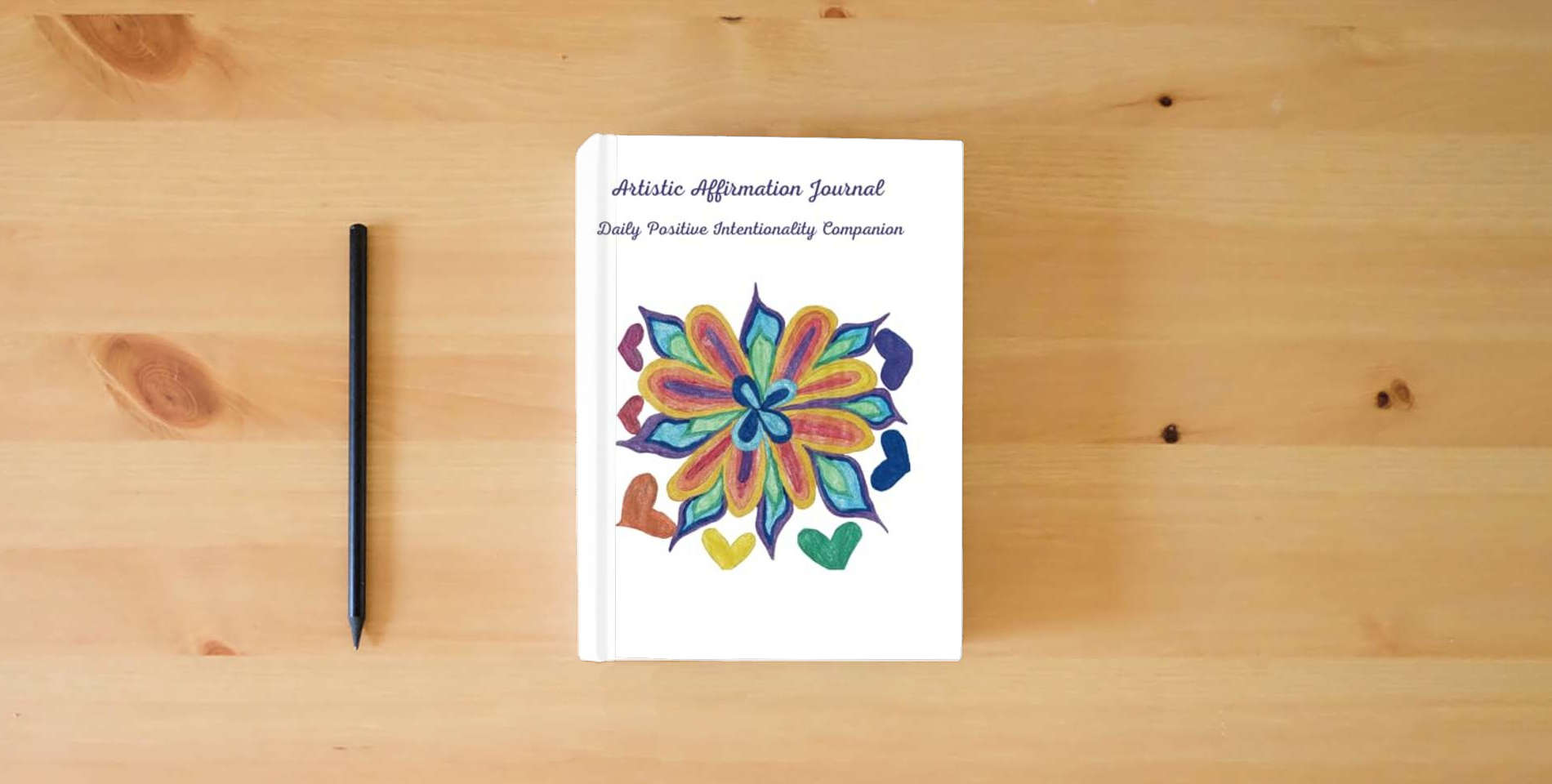 The book Artistic Affirmations Journal: A Daily Companion for Positive Intentionality is on the table