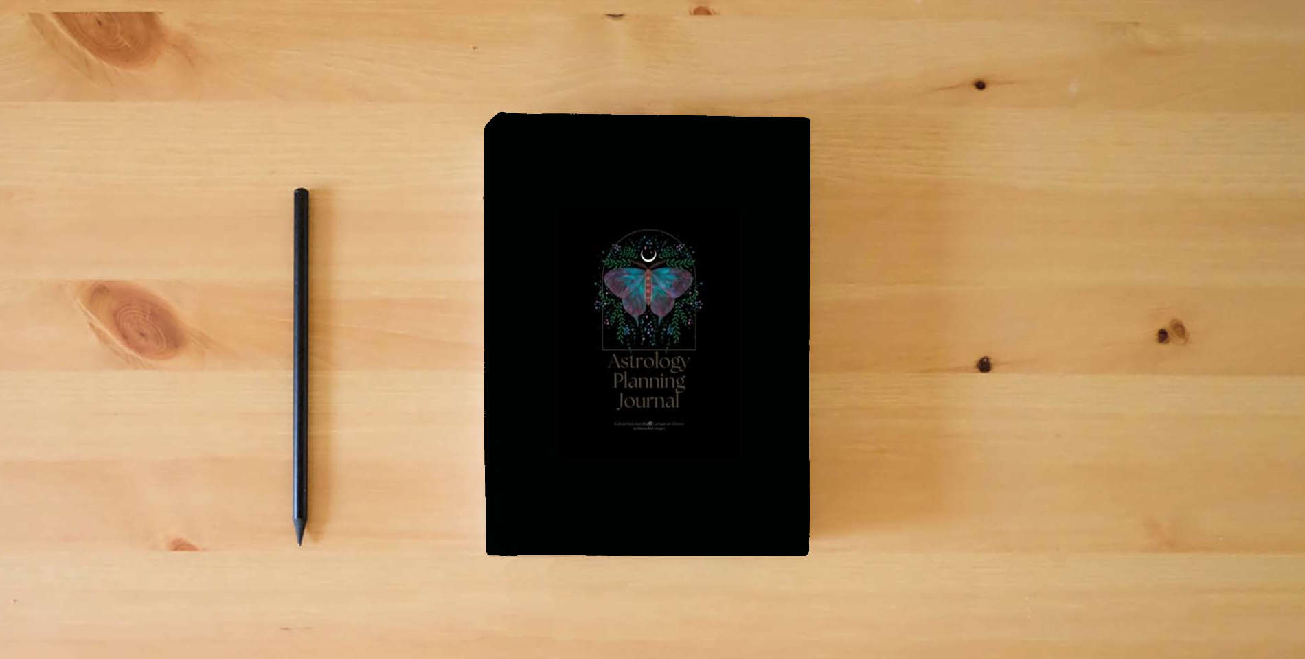The book Astrology Planning Journal: A Sticky Note Astrology Companion Planner is on the table