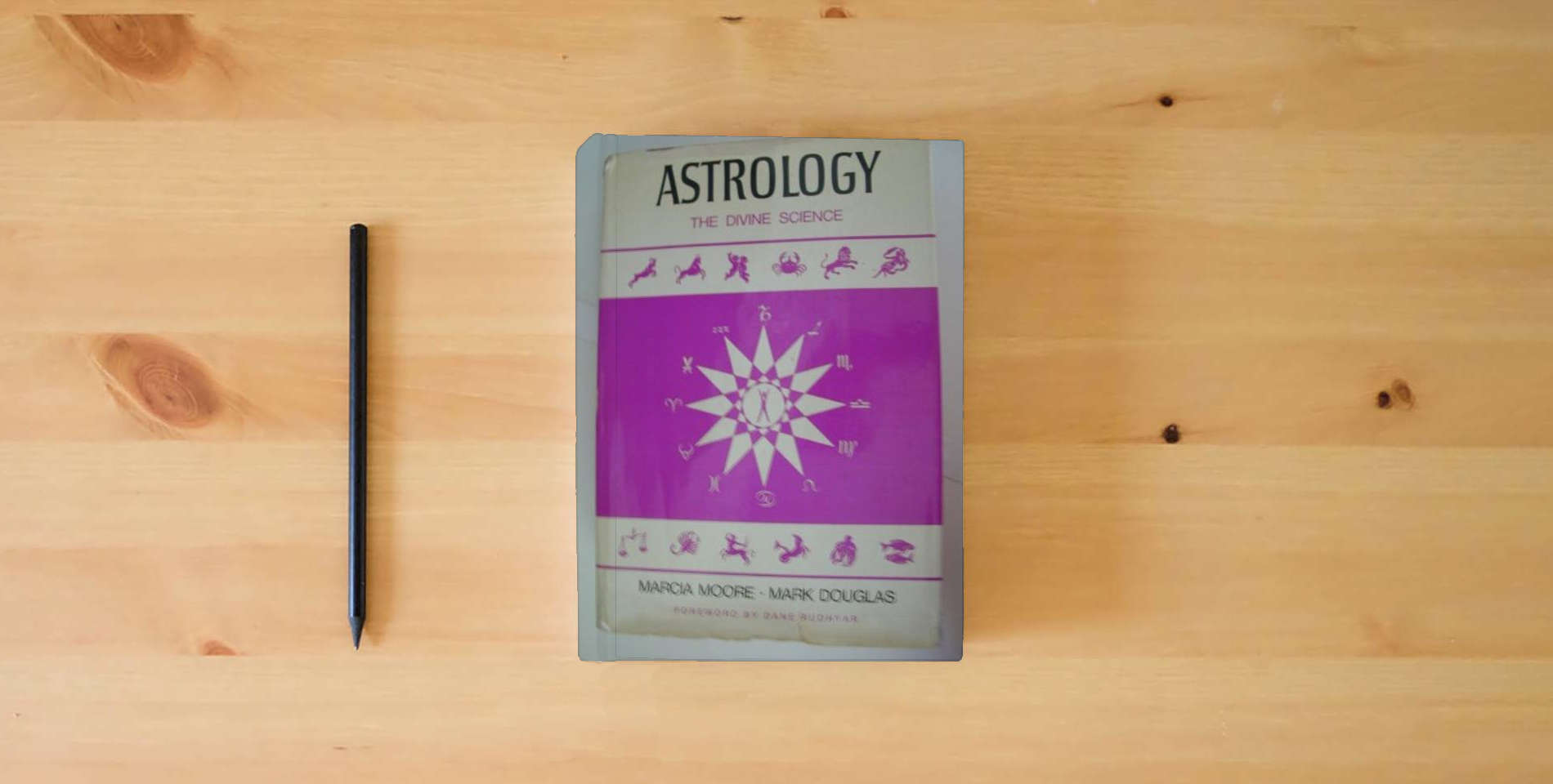 The book Astrology the Divine Science is on the table