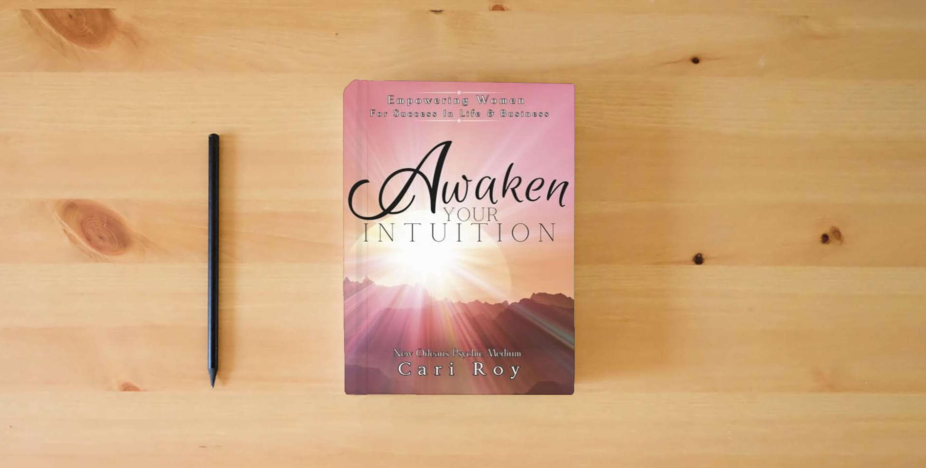 The book Awaken Your Intuition: Empowering Women For Success In Life & Business is on the table