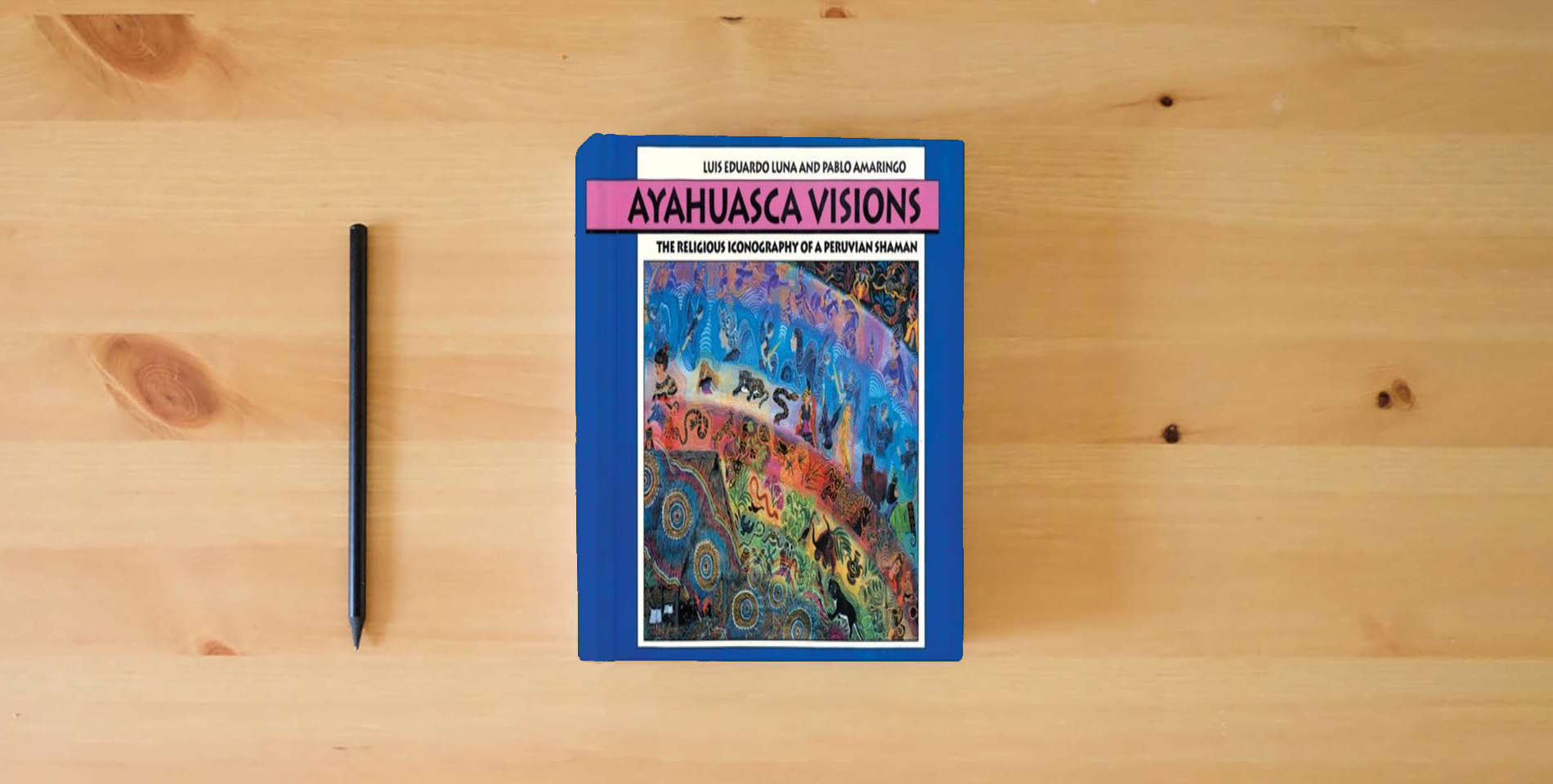 The book Ayahuasca Visions: The Religious Iconography of a Peruvian Shaman is on the table