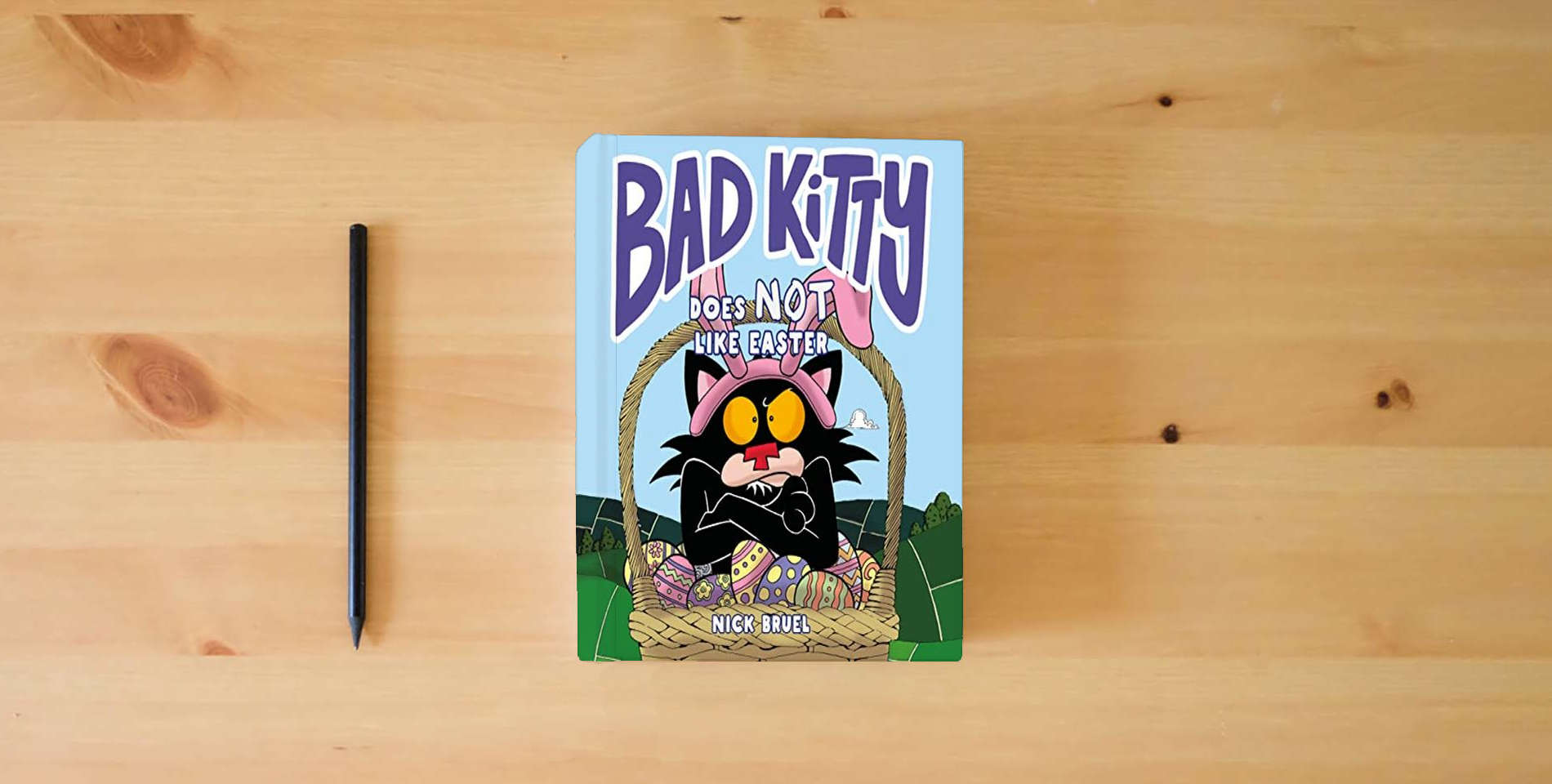 The book Bad Kitty Does Not Like Easter is on the table