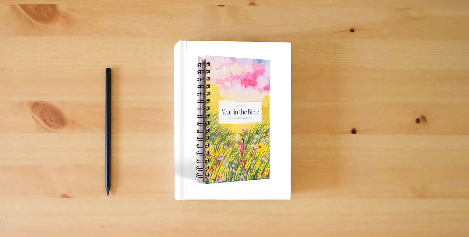 The book A Beautiful Year in the Bible: The 52-Week Bible Study for Women is on the table