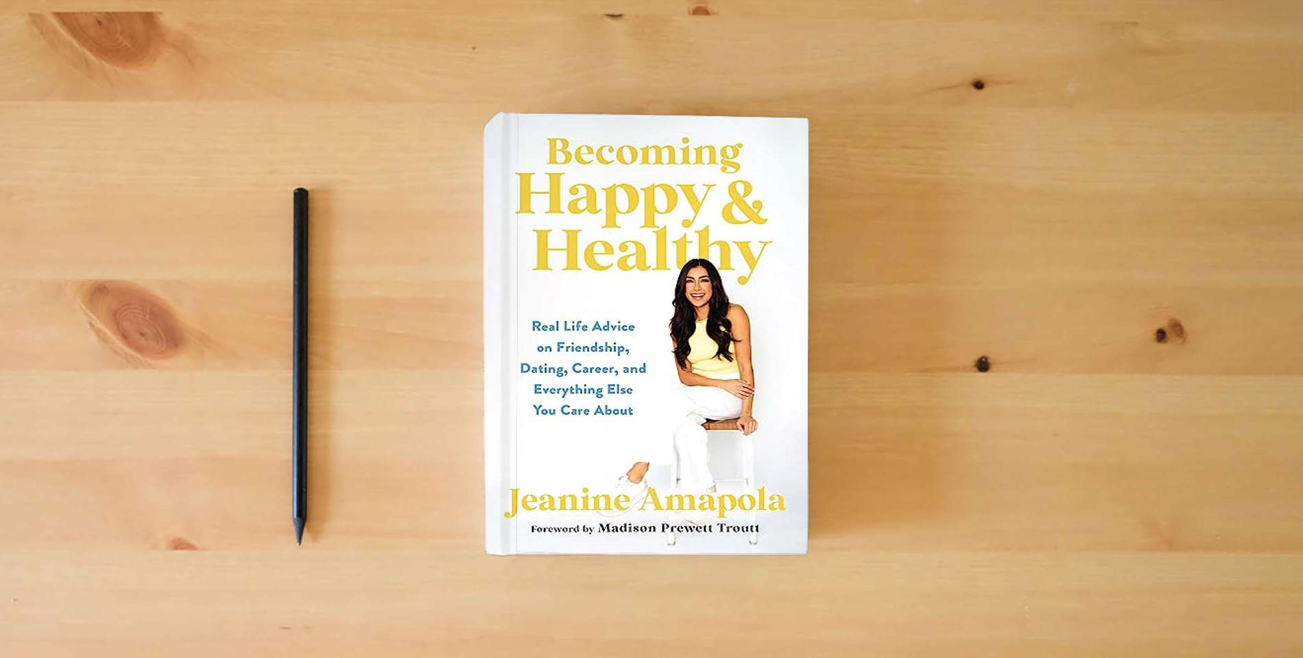 The book Becoming Happy & Healthy: Real Life Advice on Friendship, Dating, Career, and Everything Else You Care About is on the table
