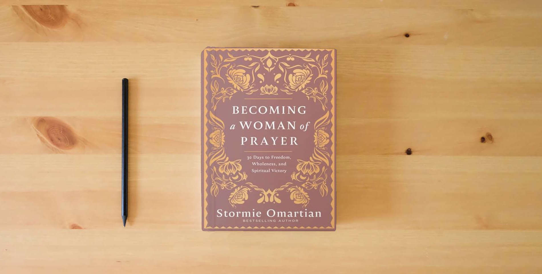 The book Becoming a Woman of Prayer: 30 Days to Freedom, Wholeness, and Spiritual Victory is on the table