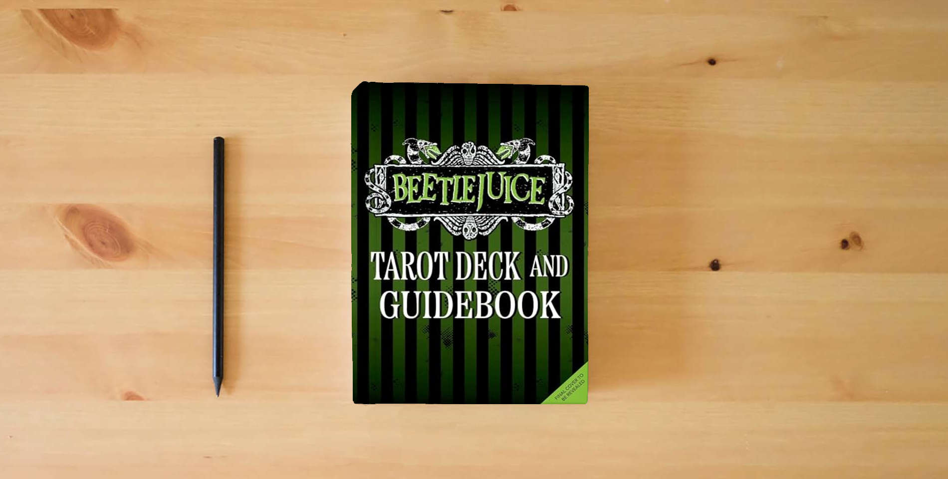 The book Beetlejuice Tarot Deck and Guide (Tarot/Oracle Decks) is on the table