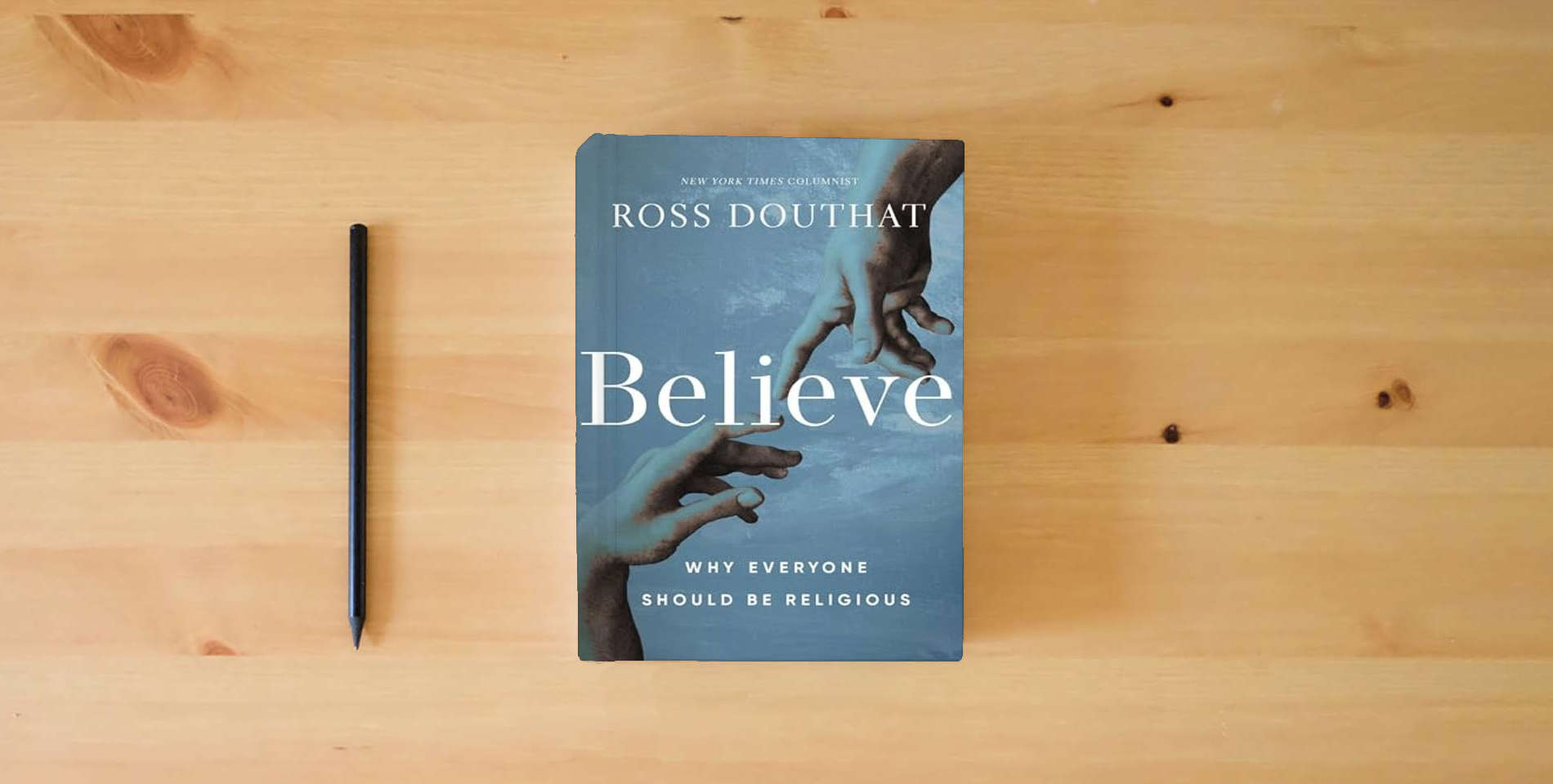 The book Believe: Why Everyone Should Be Religious is on the table