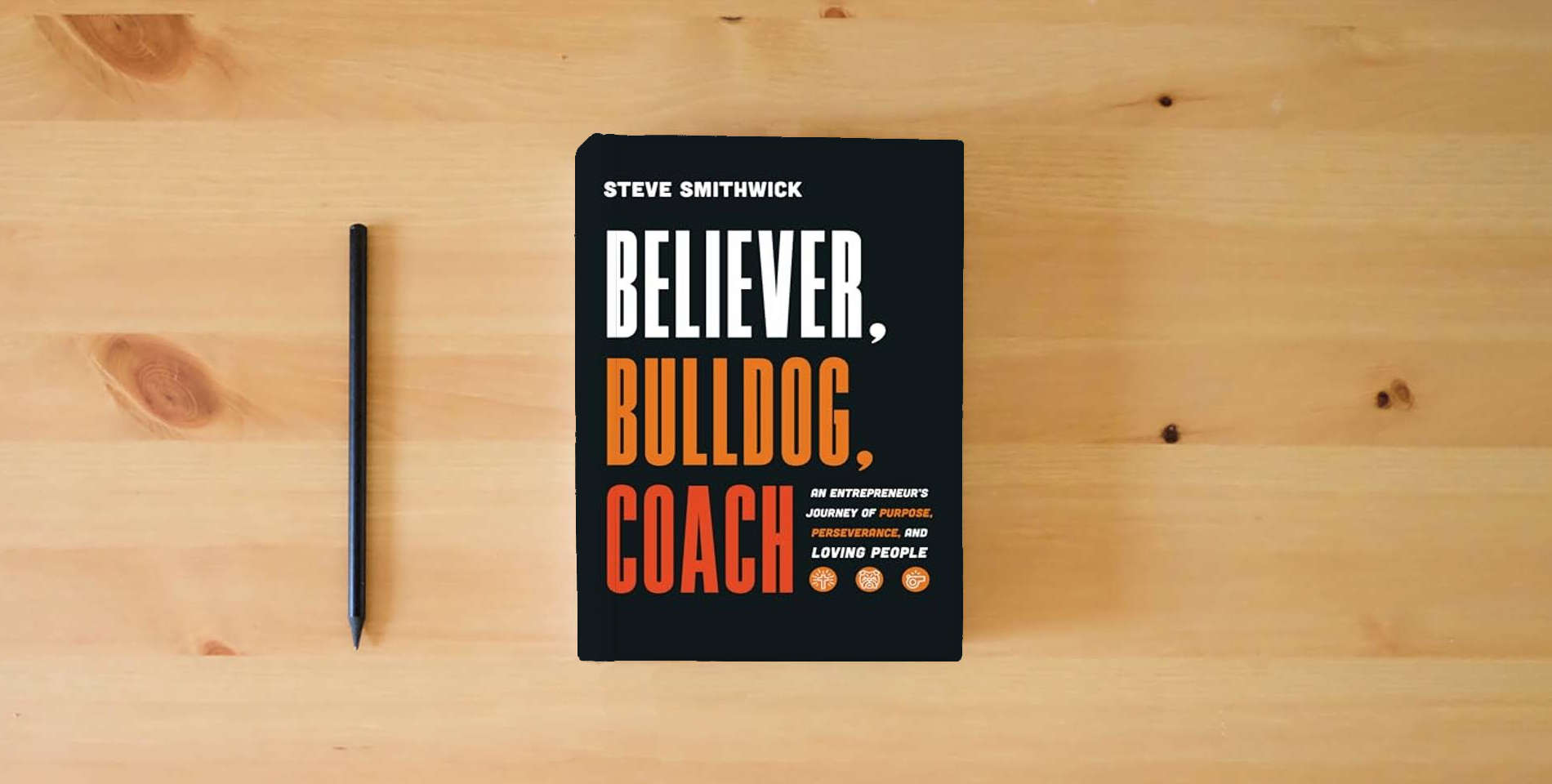 The book Believer, Bulldog, Coach: An Entrepreneur's Journey of Purpose, Perseverance, and Loving People is on the table