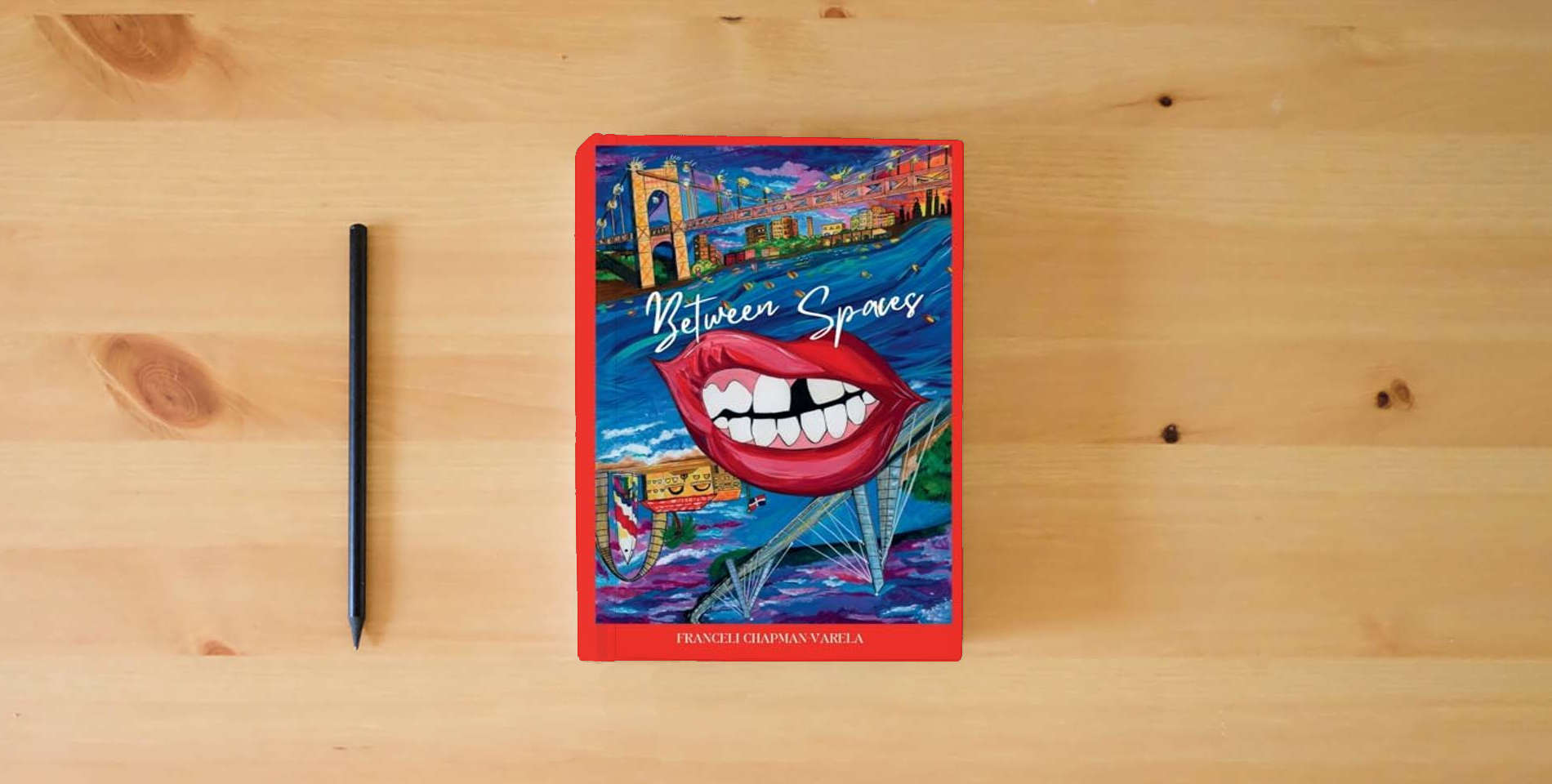 The book Between Spaces is on the table