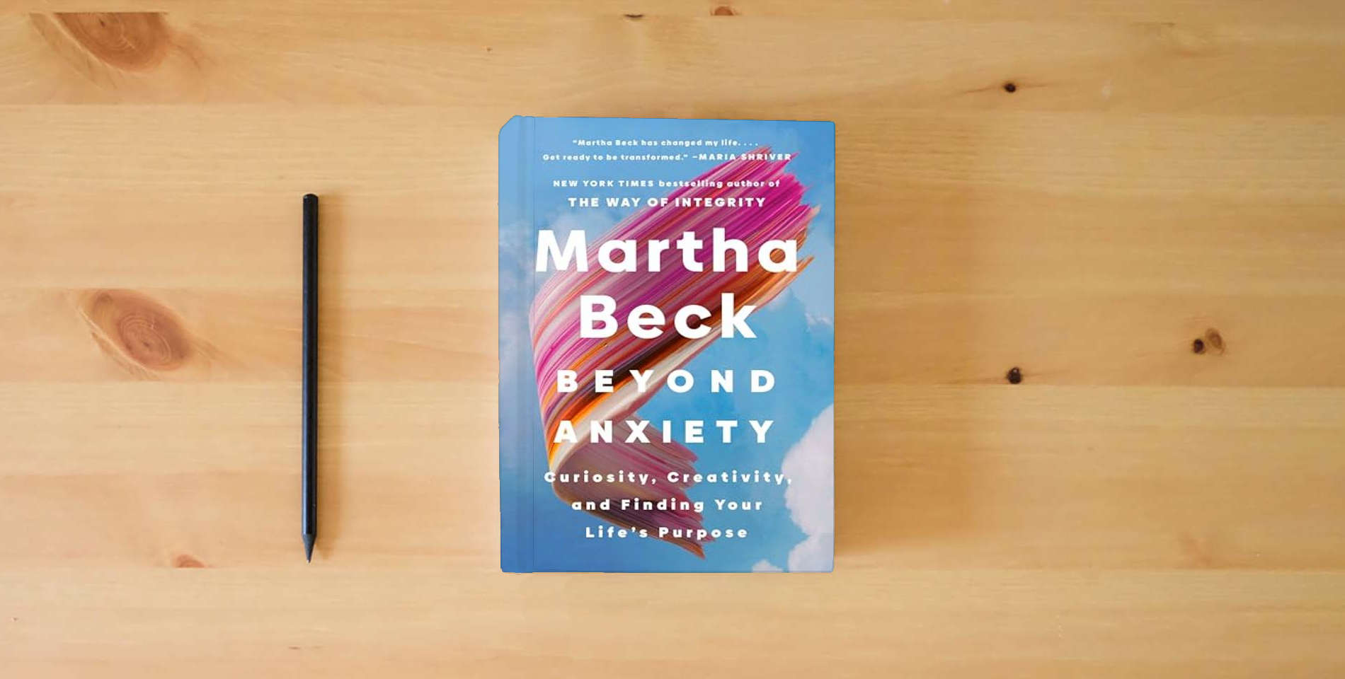 The book Beyond Anxiety: Curiosity, Creativity, and Finding Your Life's Purpose is on the table