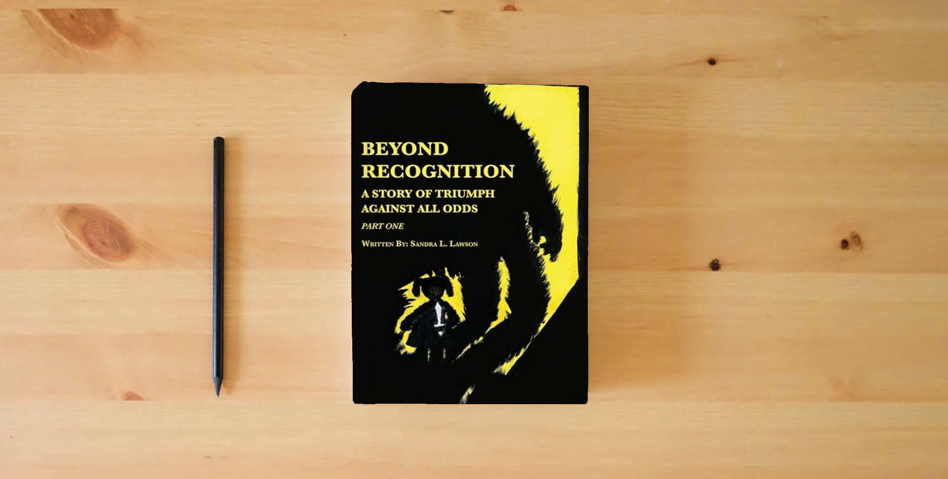 The book Beyond Recognition: A Story of Triumph Against All Odds Part One is on the table