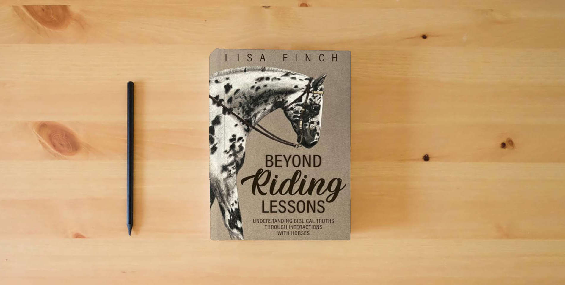 The book Beyond Riding Lessons: Understanding Biblical Truths Through Interactions With Horses is on the table