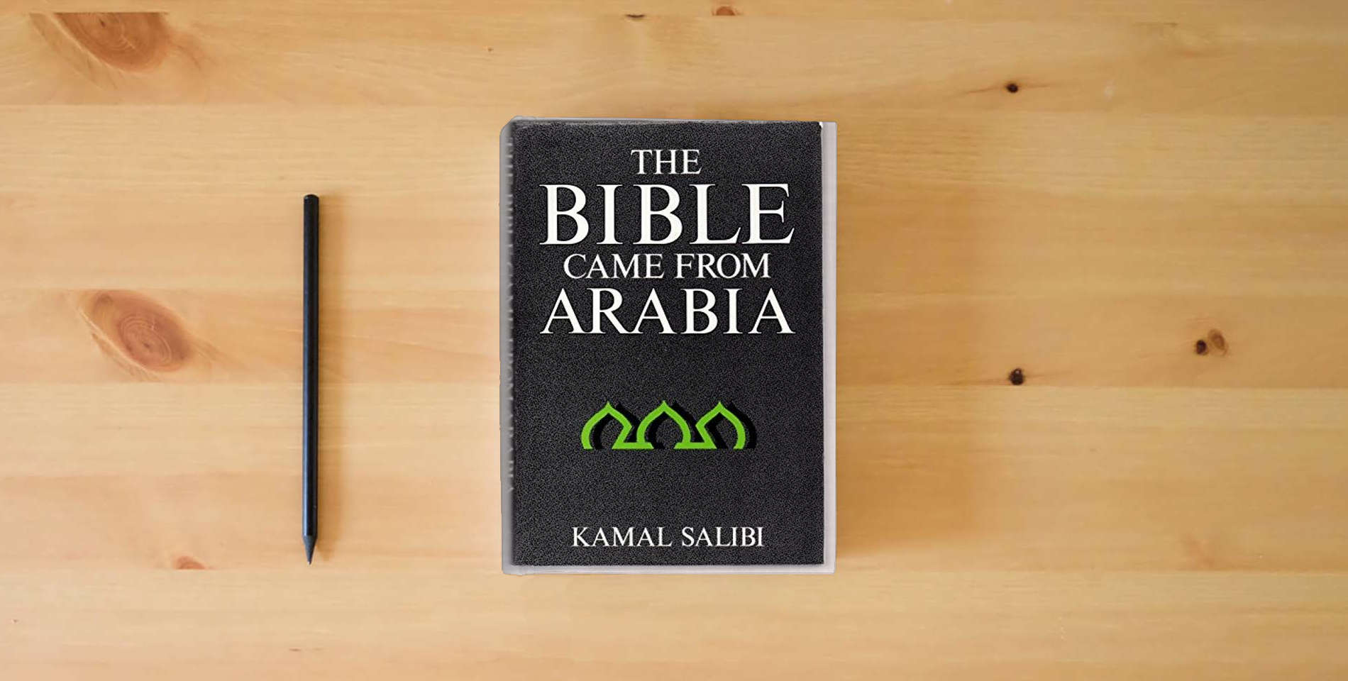The book Bible Came Frm Arabia is on the table