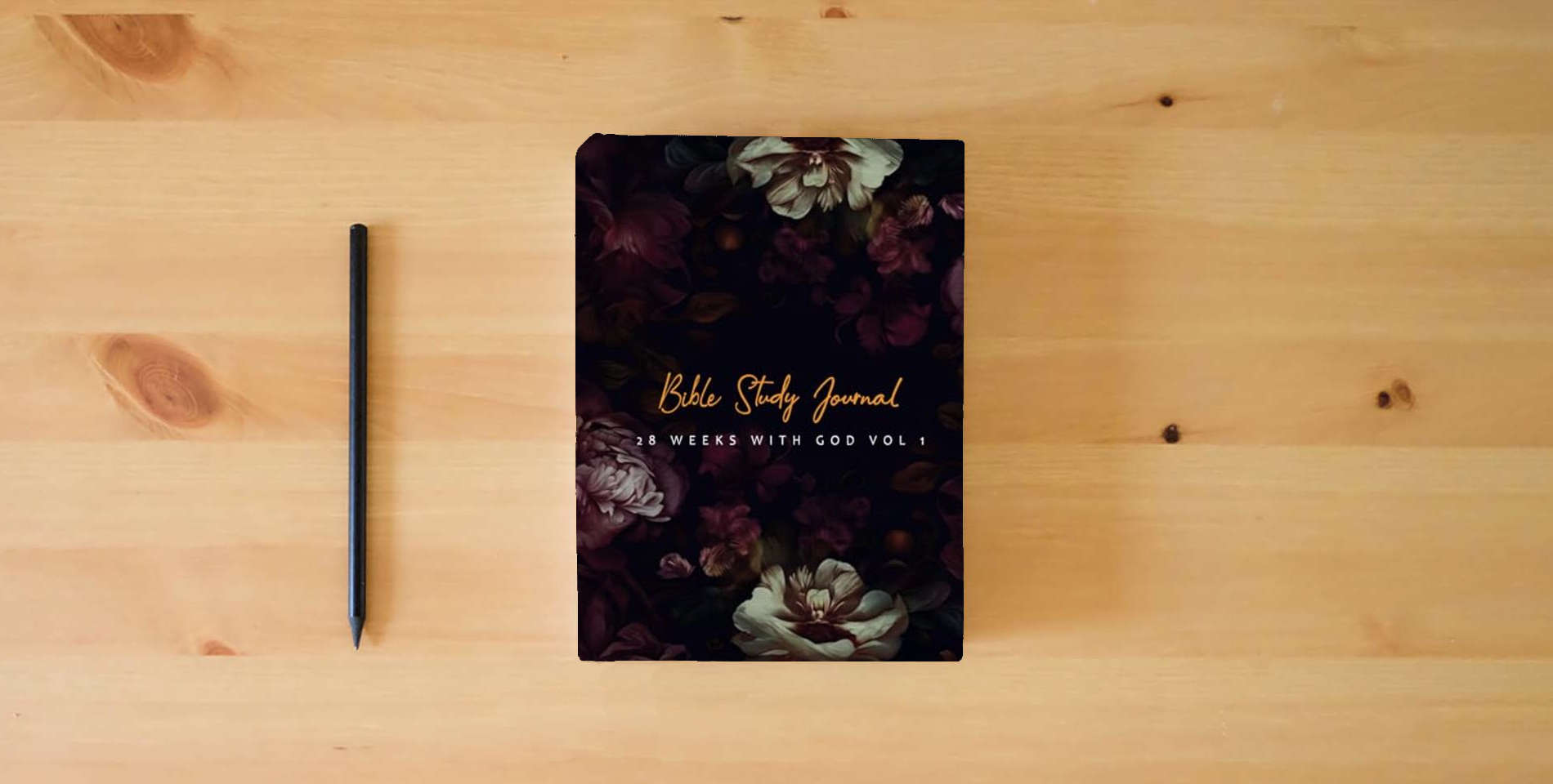 The book Bible Study Journal: 28 Weeks with God Vol 1 is on the table
