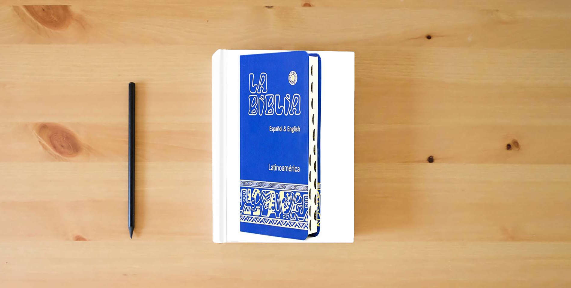 The book La Biblia Latinoamérica - Español & English (símil-piel) is on the table