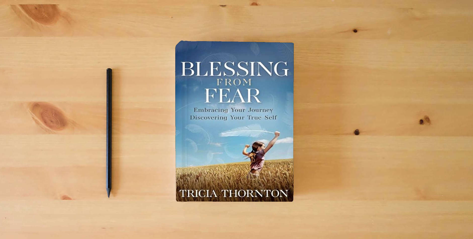 The book Blessing From Fear: Embracing Your Journey – Discovering Your True Self is on the table