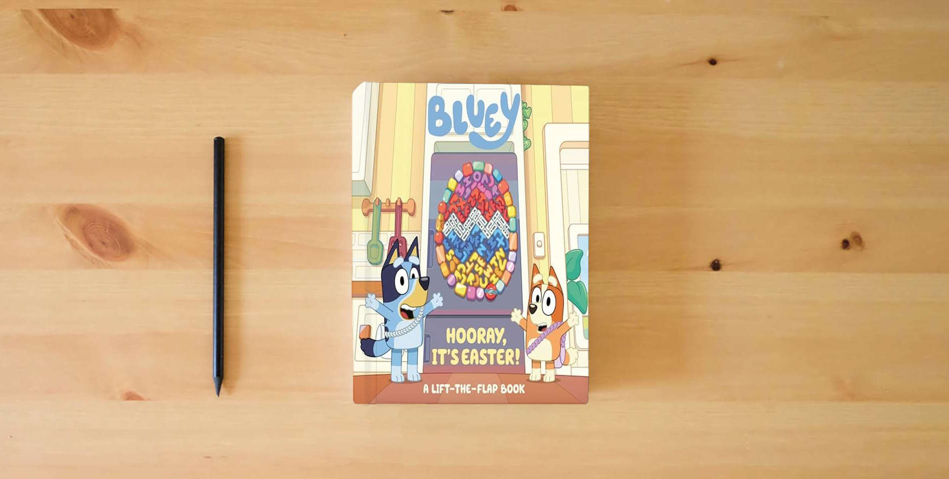 The book Bluey: Hooray, It's Easter!: A Lift-the-Flap Book is on the table