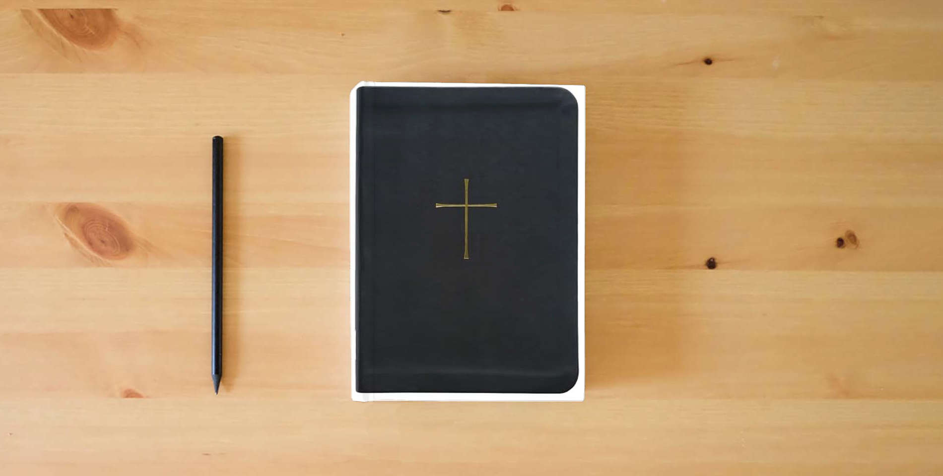 The book Book of Common Prayer and Holy Bible, NRSVue with Apocrypha is on the table