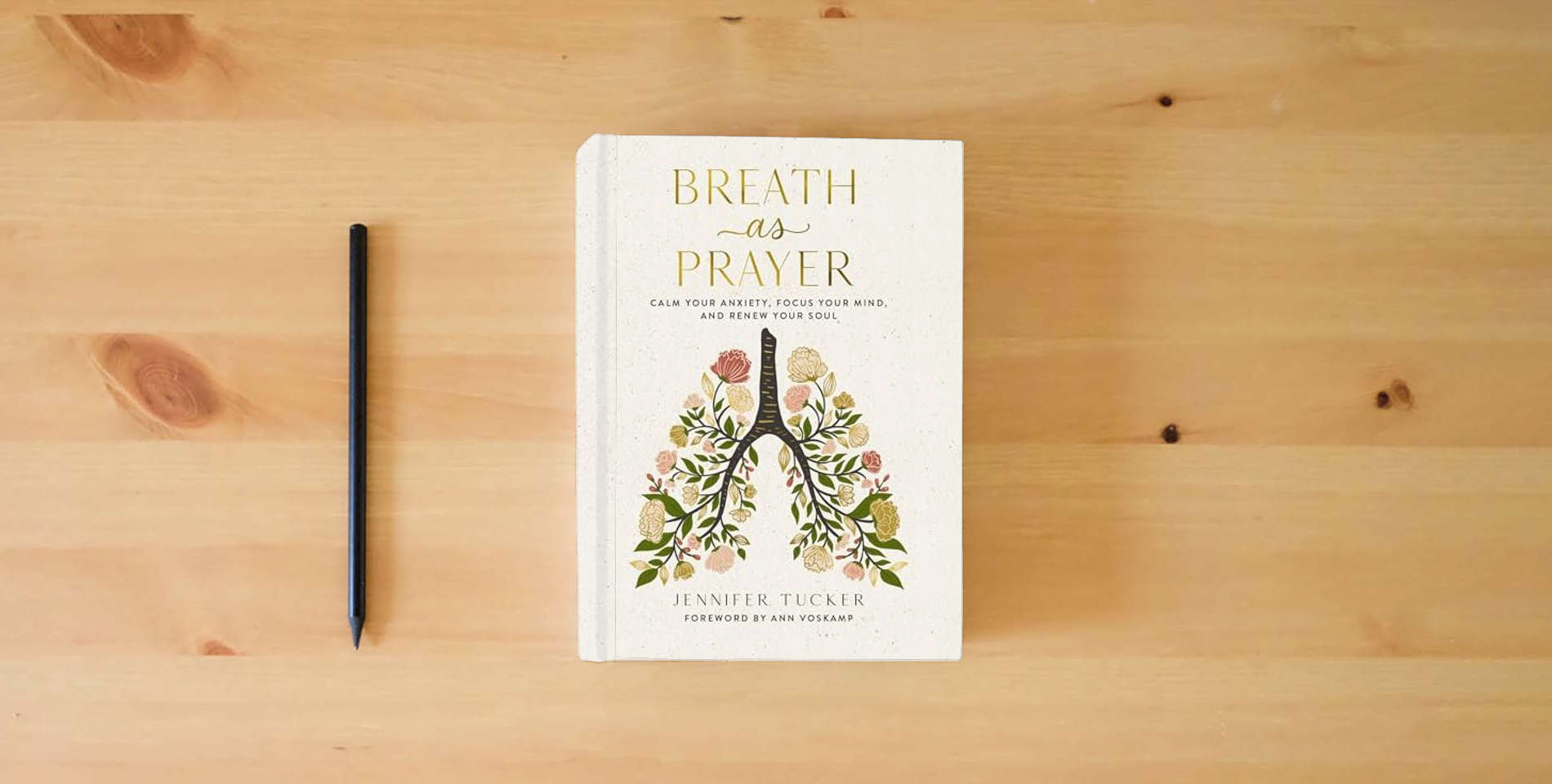 The book Breath as Prayer: Calm Your Anxiety, Focus Your Mind, and Renew Your Soul (80+ Breath Prayers and Devotional Meditations) – The Perfect Christian Gift for Women is on the table