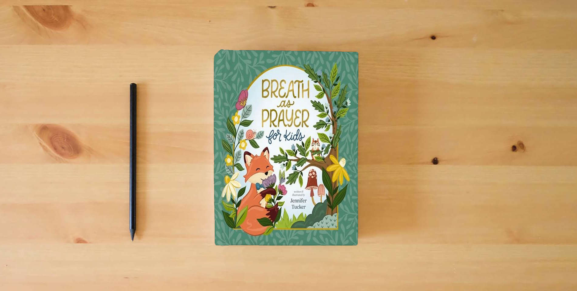 The book Breath as Prayer for Kids is on the table