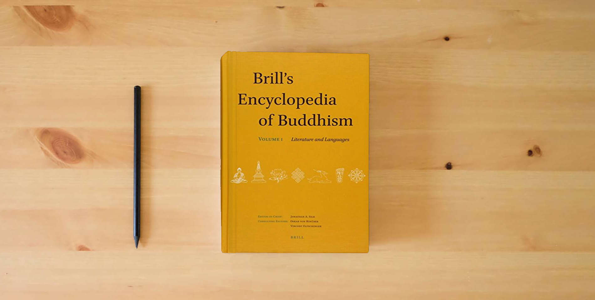 The book Brill's Encyclopedia of Buddhism. Volume One: Literature and Languages (Handbook of Oriental Studies. Section 2 South Asia / Brill's) is on the table