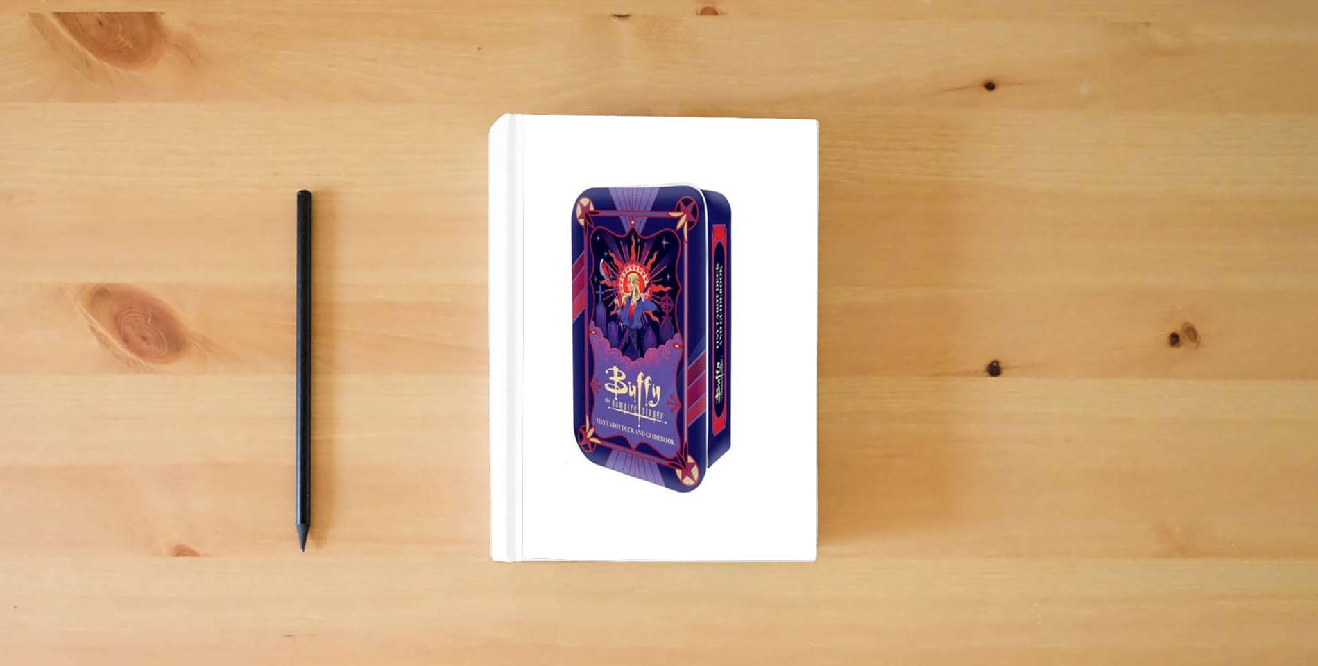 The book Buffy the Vampire Slayer Tiny Tarot Deck and Guidebook is on the table