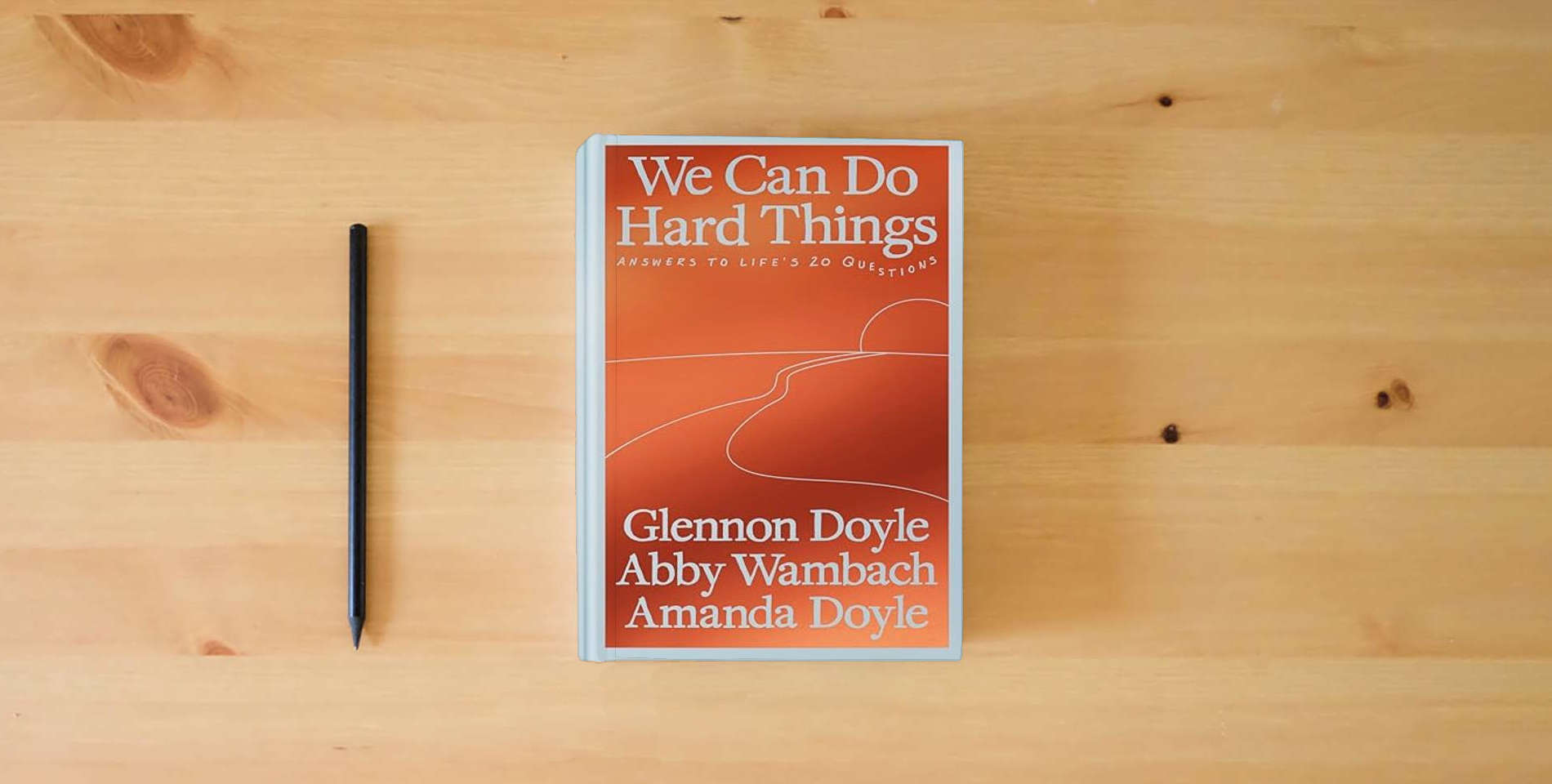 The book We Can Do Hard Things: Answers to Life's 20 Questions is on the table