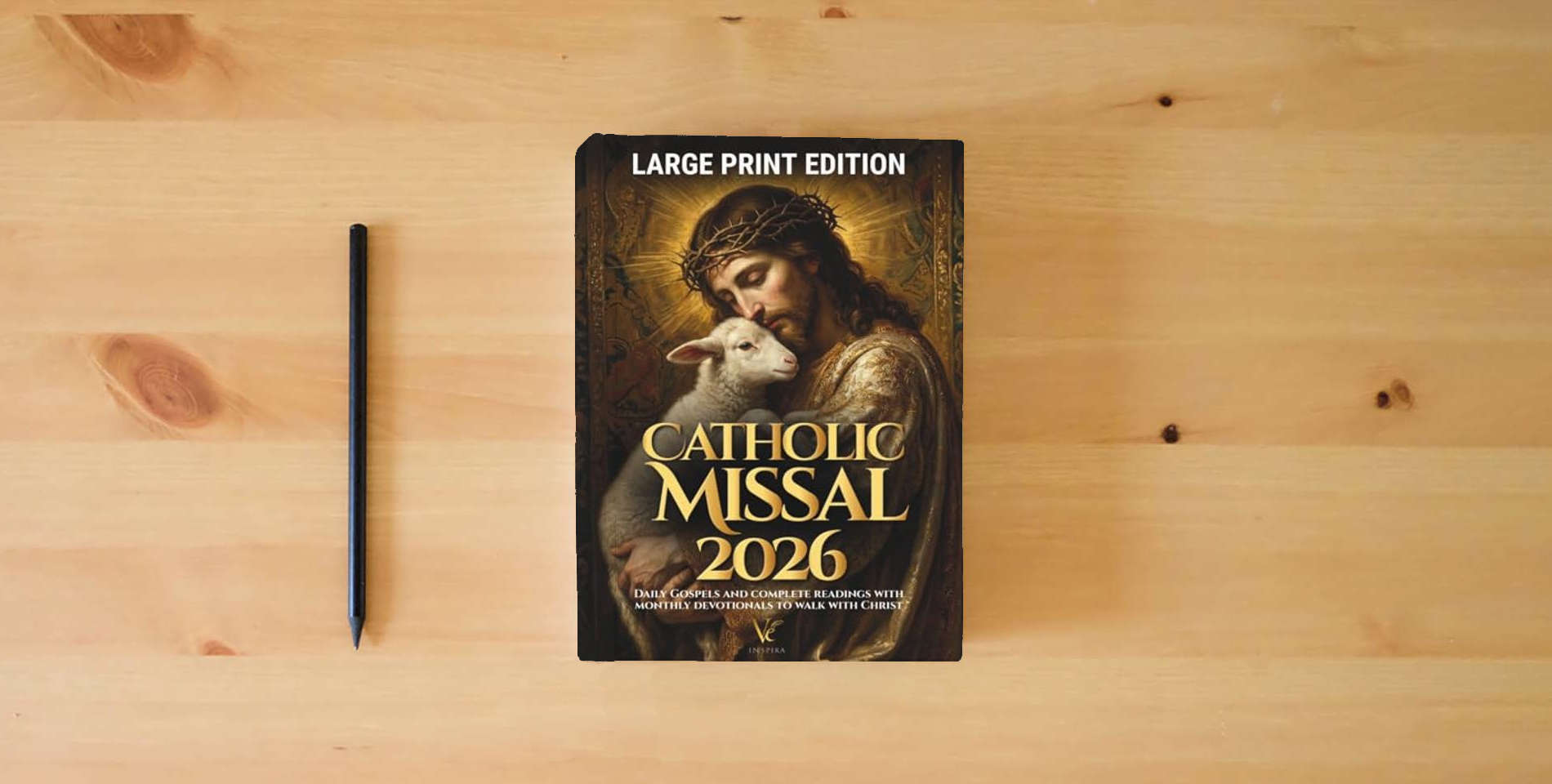 The book Catholic Missal 2026 | Large Print: Daily Gospels and Complete Mass Readings with Monthly Devotionals to Walk with Christ is on the table
