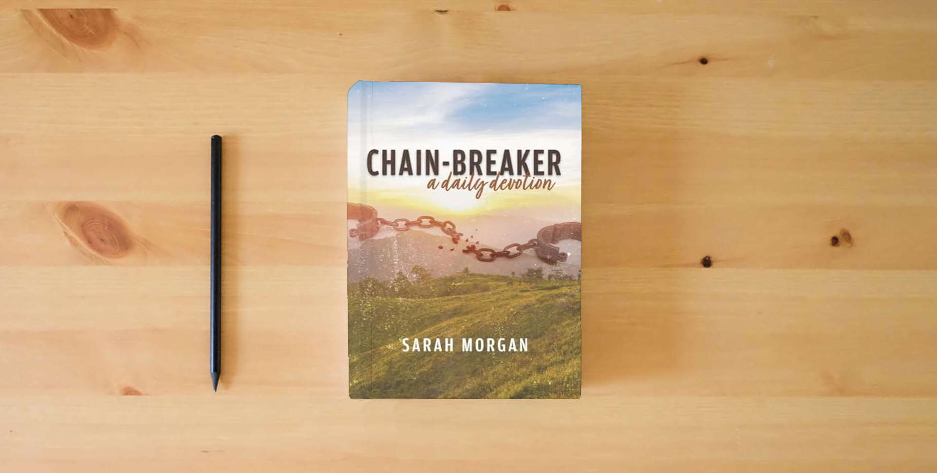 The book Chain-breaker: a daily devotion is on the table