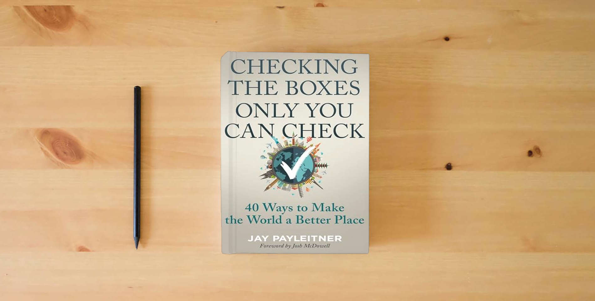 The book Checking the Boxes Only You Can Check: 40 Ways to Make the World a Better Place is on the table