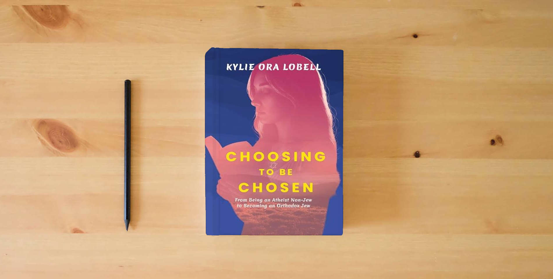 The book Choosing to Be Chosen: From Being an Atheist Non-Jew to Becoming an Orthodox Jew is on the table