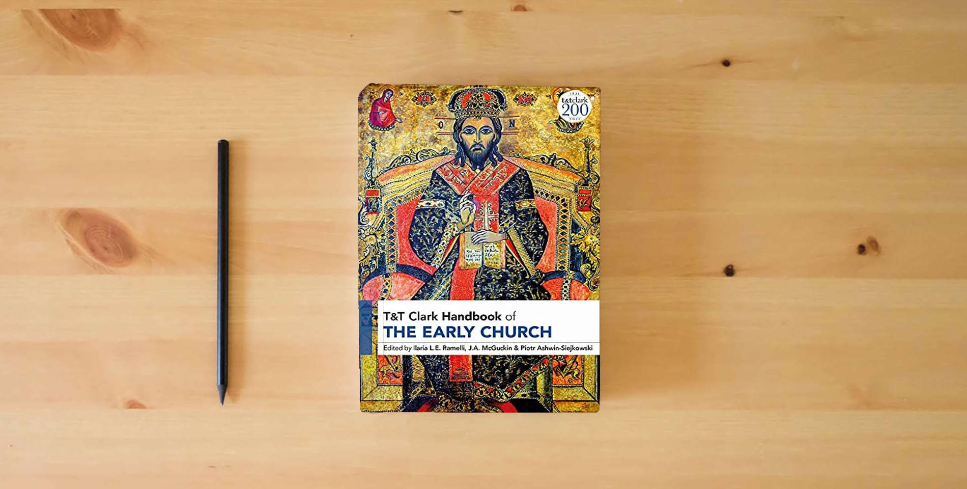 The book T&T Clark Handbook of the Early Church (T&T Clark Handbooks) is on the table